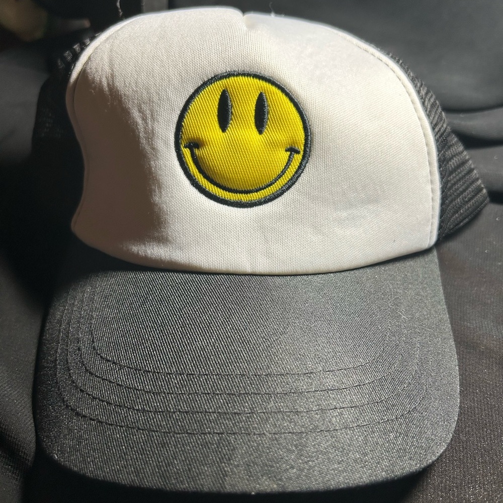 Black Mesh Cap with Smiley Design. Features snap back. Unbranded